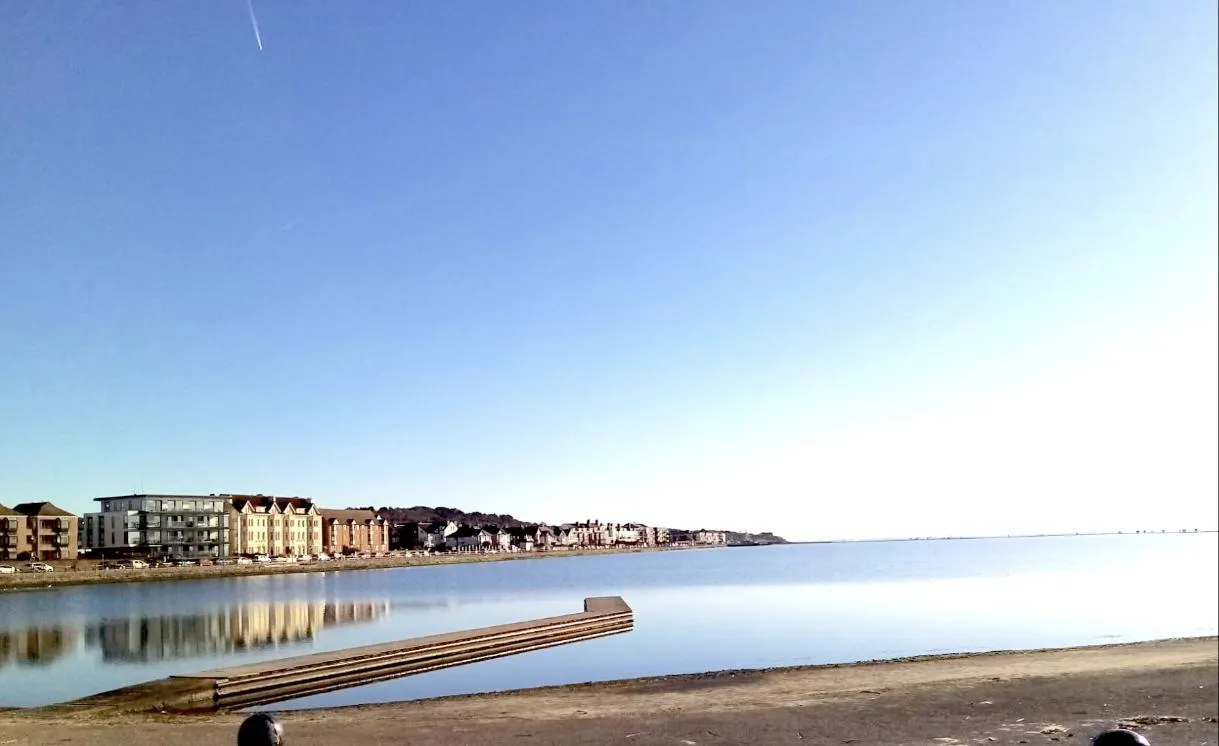West Kirby Marine Lake on a clear morning, with the seafront behind